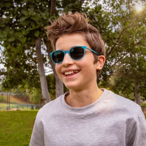 Boy wearing sunglasses outside