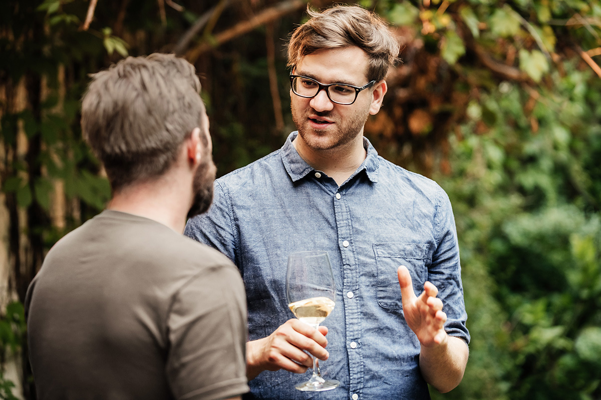 3248-december blonde man with glasses chatting.jpg